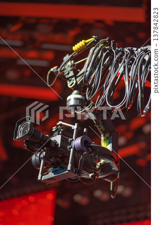 Professional Cinema Camera on Robotic Crane Jib at Concert Stage with copy space 137842823