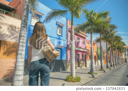 Young Woman Traveler Walking on Colorful Street in Santa Cruz de Tenerife with copy space Young Woman Traveler Walking on Colorful Street in Santa Cruz de Tenerife with copy space 137842833