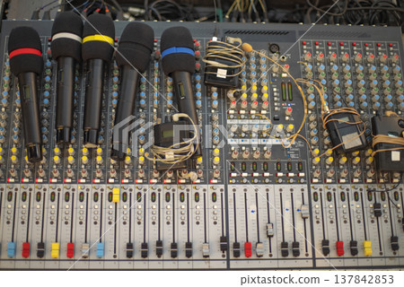 Professional Wireless Microphones Set on Audio Mixing Console with copy space 137842853