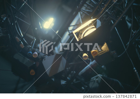 Professional Studio Spotlights Glowing in Dark Backstage with copy space Professional Studio Spotlights Glowing in Dark Backstage with copy space 137842871