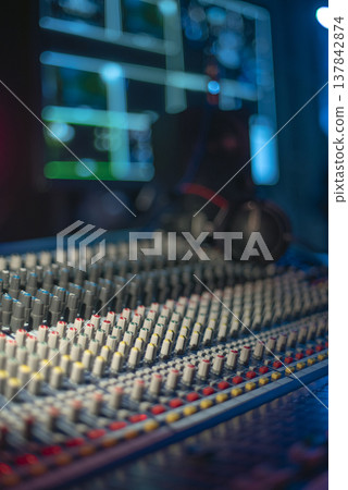 Professional Mixing Console and Headphones in Creative Studio with copy space Professional Mixing Console and Headphones in Creative Studio with copy space 137842874