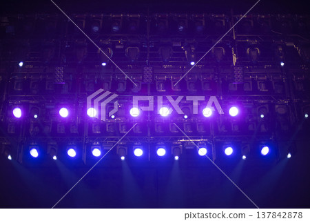 Professional Stage Lighting Rig with Purple and Blue Spotlights in Dark with copy space 137842878