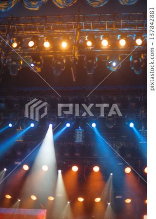 Professional Stage Lighting Rig with Blue and Orange Spotlights with copy space 137842881