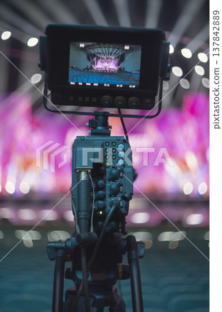 Professional video camera recording live music concert with copy space Professional video camera recording live music concert with copy space 137842889
