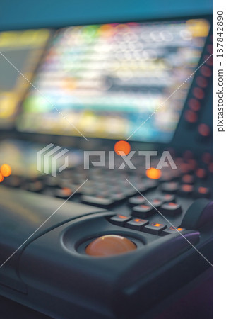 Professional lighting console in dark studio with orange trackball and bokeh copy space 137842890