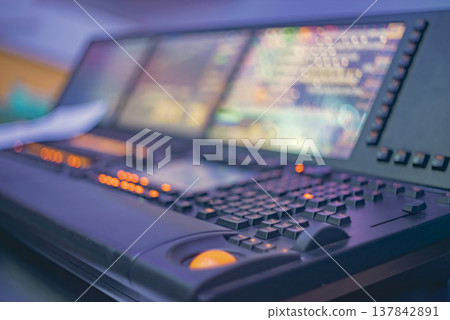 High-tech stage lighting control system with glowing buttons and monitors with copy space High-tech stage lighting control system with glowing buttons and monitors with copy space 137842891
