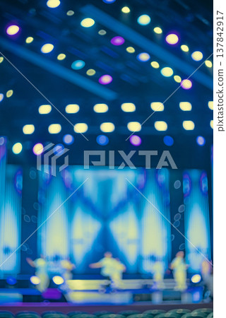 Blurred Concert Stage with Dancers Performance and Blue Lights with copy space 137842917