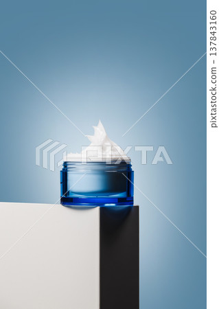 Blue moisturizer jar with whipped cream texture Blue moisturizer jar with whipped cream texture 137843160