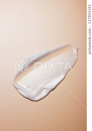 Textured White Lotion Swipe on Satin Beige Textured White Lotion Swipe on Satin Beige 137843161