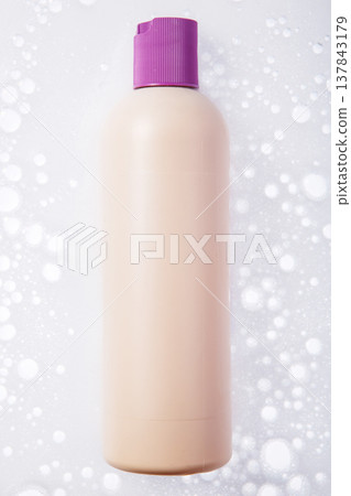 Closeup Beige Bottle with Purple Flip Cap Closeup Beige Bottle with Purple Flip Cap 137843179