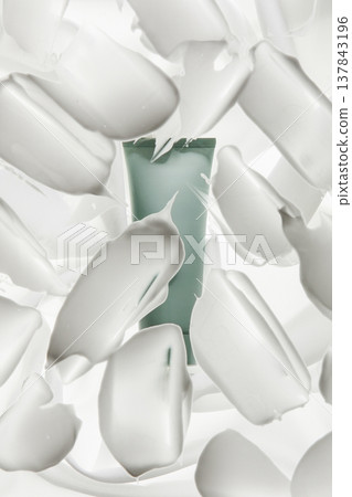 Cosmetic Tube Behind White Cream Smears 137843196