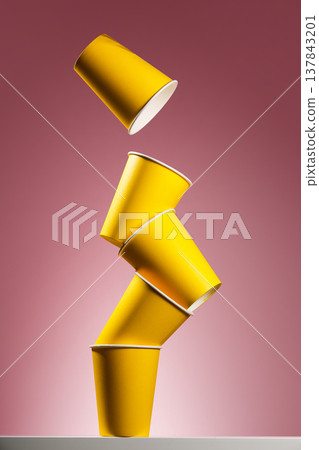 Levitating yellow coffee cups for promo concept 137843201