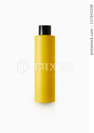 Yellow cosmetic bottle isolated on gray background Yellow cosmetic bottle isolated on gray background 137843206