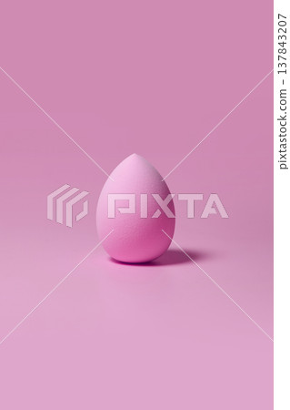 Pink makeup sponge on pastel pink background 137843207