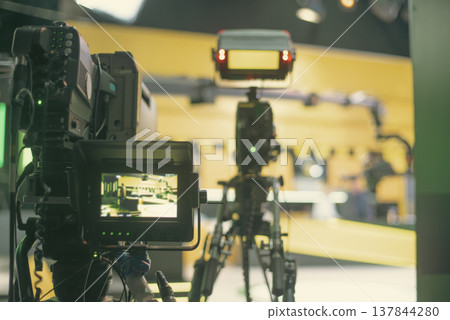 Professional broadcasting cameras and crane in modern TV studio with copy space 137844280