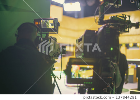 Professional cameramen filming live show in modern TV studio with copy space 137844281