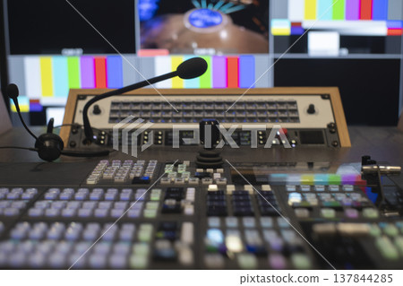 Video switcher and microphone in broadcasting control room with copy space 137844285