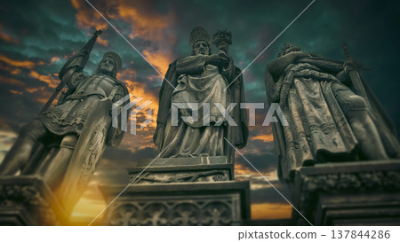 Ancient statues on Charles Bridge in Prague at fiery sunset with copy space Ancient statues on Charles Bridge in Prague at fiery sunset with copy space 137844286