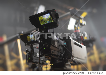 Professional broadcasting cameras in modern TV studio with equipment and copy space 137844334