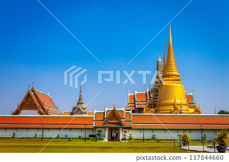 Temple Wat Phra Kaew is in the Royal Palace of Bangkok, Thailand. It is a popular place and destination for tourists around the world. Temple Wat Phra Kaew is in the Royal Palace of Bangkok, Thailand. It is a popular place and destination for tourists around the world. 137844660