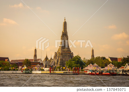 Wat Arun with the Chao Phraya River in front of it is a popular destination for tourists around the world. Bangkok Thailand 137845071