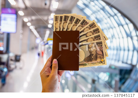 Handy passport and yen for shopping and sightseeing at the airport. 137845117