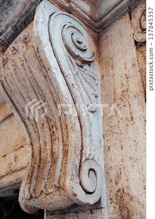 Carved stone column detail shows intricate design in an old building 137845357