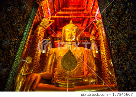 Big golden Buddha statue in temple at Wat Phanan Choeng Worawihan temple, Ayutthaya, Thailand, World Heritage Big golden Buddha statue in temple at Wat Phanan Choeng Worawihan temple, Ayutthaya, Thailand, World Heritage 137845607