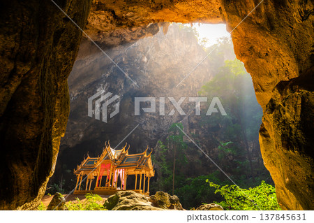 Amazing Phraya Nakhon cave in Khao Sam Roi Yot national park at Prachuap Khiri Khan Thailand is small temple in the sun rays in cave. Amazing Phraya Nakhon cave in Khao Sam Roi Yot national park at Prachuap Khiri Khan Thailand is small temple in the sun rays in cave. 137845631