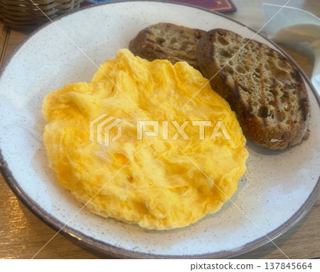 Egg omelette on a plate with rye bread Egg omelette on a plate with rye bread 137845664