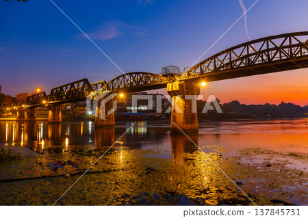 Beautiful Landscape of Bridge River Kwai at Kanchanaburi, Thailand in sunrise time. Is a famous place and a tourist destination 137845731