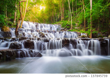 Sam Lan Waterfall is a beautiful tiered waterfall located deep in the forest of Saraburi Province, Thailand. Sam Lan Waterfall is a beautiful tiered waterfall located deep in the forest of Saraburi Province, Thailand. 137845739