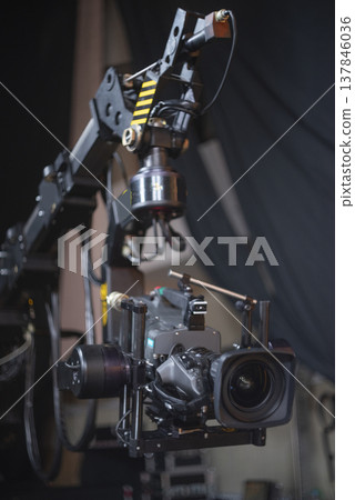 Professional Broadcast Camera on Robotic Crane in Studio with Copy Space Professional Broadcast Camera on Robotic Crane in Studio with Copy Space 137846036