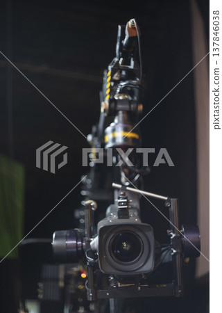 Professional Cinema Camera on Robotic Crane in Studio with Copy Space Professional Cinema Camera on Robotic Crane in Studio with Copy Space 137846038