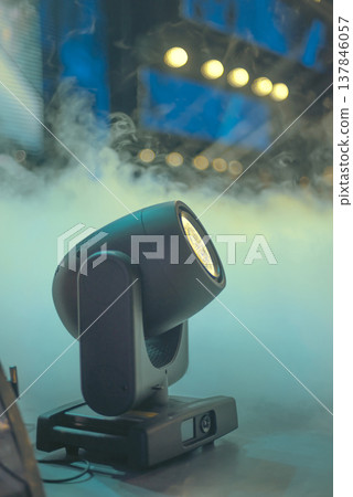 Professional Moving Head Stage Light in Fog on Concert Backdrop with Copy Space 137846057