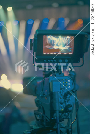 Professional Television Camera Filming Live Event on Stage with Copy Space 137846080