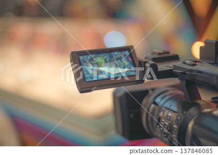Professional Video Camera Recording Lottery Show with Bokeh and Copy Space Professional Video Camera Recording Lottery Show with Bokeh and Copy Space 137846085