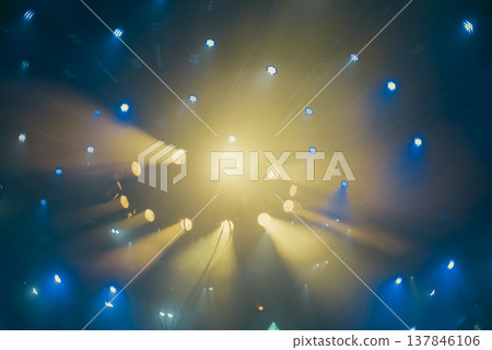 Abstract Stage Light Explosion with Yellow Beams and Teal Spotlights with copy space Abstract Stage Light Explosion with Yellow Beams and Teal Spotlights with copy space 137846106