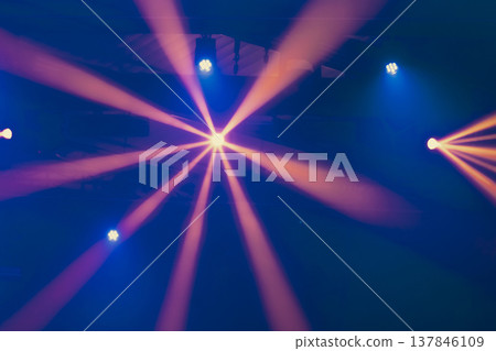 Abstract Stage Spotlight with Radial Orange Beams and Blue Accents with copy space Abstract Stage Spotlight with Radial Orange Beams and Blue Accents with copy space 137846109