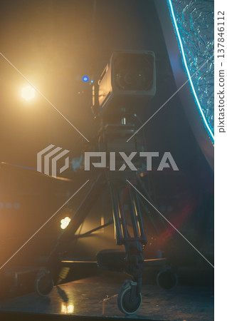 Professional Broadcasting Camera on Tripod in Cinematic Studio Lighting with copy space Professional Broadcasting Camera on Tripod in Cinematic Studio Lighting with copy space 137846112