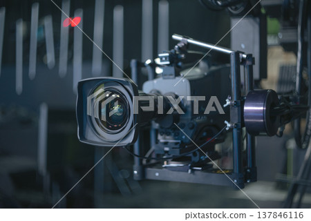 Professional Cinema Camera on Stabilizer in Dark Studio with Copy Space 137846116