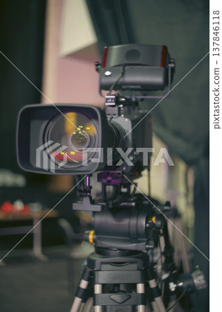 Professional Broadcast Video Camera on Tripod in Media Studio with Copy Space 137846118