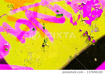 Yellow and Pink Graffiti Texture on Peeling Urban Wall Yellow and Pink Graffiti Texture on Peeling Urban Wall 137846189