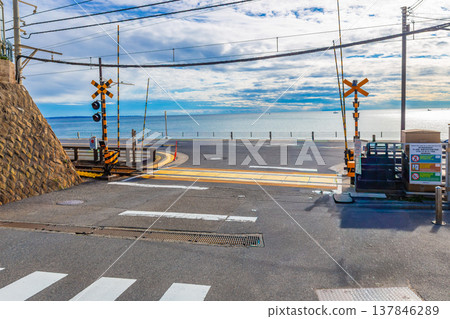The Enoden Line with the sea as a background at Kamakura Kokomae station, one of the scenes in the anime Slamdunk, is a popular tourist attraction in Kamakura, Japan. The Enoden Line with the sea as a background at Kamakura Kokomae station, one of the scenes in the anime Slamdunk, is a popular tourist attraction in Kamakura, Japan. 137846289