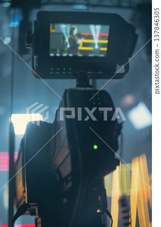 Professional Video Camera Viewfinder showing Presenter in TV Studio with copy space Professional Video Camera Viewfinder showing Presenter in TV Studio with copy space 137846305
