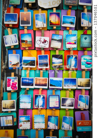 Chonburi, Thailand - October 21, 2012: Small poster attached with a clip and magnet as a souvenir of Koh Larn, Pattaya, Chonburi, Thailand. 137846581