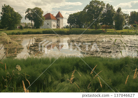 Medieval Purtse Castle in Estonia with Lake Reflection and Copy Space 137846627