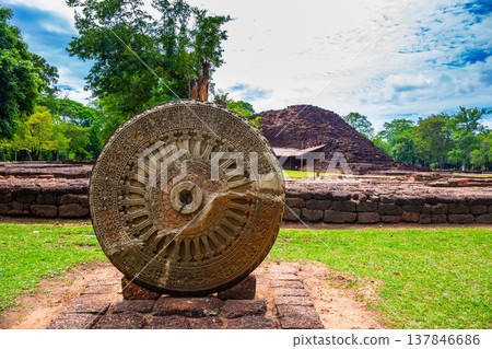 Large Thammachak carved stone, Dvaravati period art, located in Si Thep Historical Park, Phetchabun, Thailand Large Thammachak carved stone, Dvaravati period art, located in Si Thep Historical Park, Phetchabun, Thailand 137846686