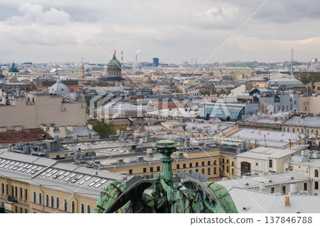 St. Petersburg showcases a breathtaking skyline filled with various rooftops and domes, including prominent structures beneath a dramatic sky. St. Petersburg showcases a breathtaking skyline filled with various rooftops and domes, including prominent structures beneath a dramatic sky. 137846788
