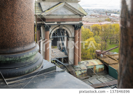 Workers restore a historic site in St. Petersburg, highlighting the intricate architecture and scaffolding details. Workers restore a historic site in St. Petersburg, highlighting the intricate architecture and scaffolding details. 137846896